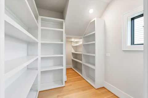 a kitchen with stainless steel appliances granite countertop a sink and a stove