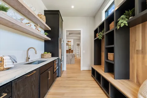 a view of entryway and hall with wooden floor