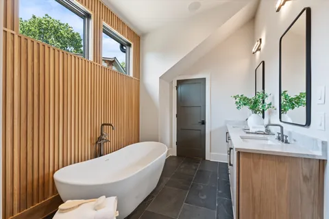 a bathroom with a bathtub and shower