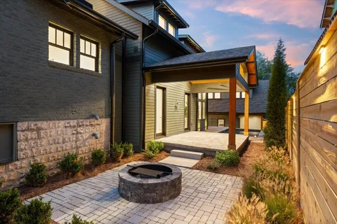 a swimming pool with outdoor seating and yard