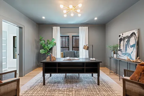 a view of a workspace with furniture