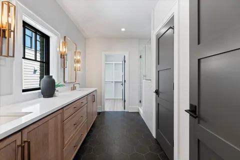a bathroom with a shower and a sink
