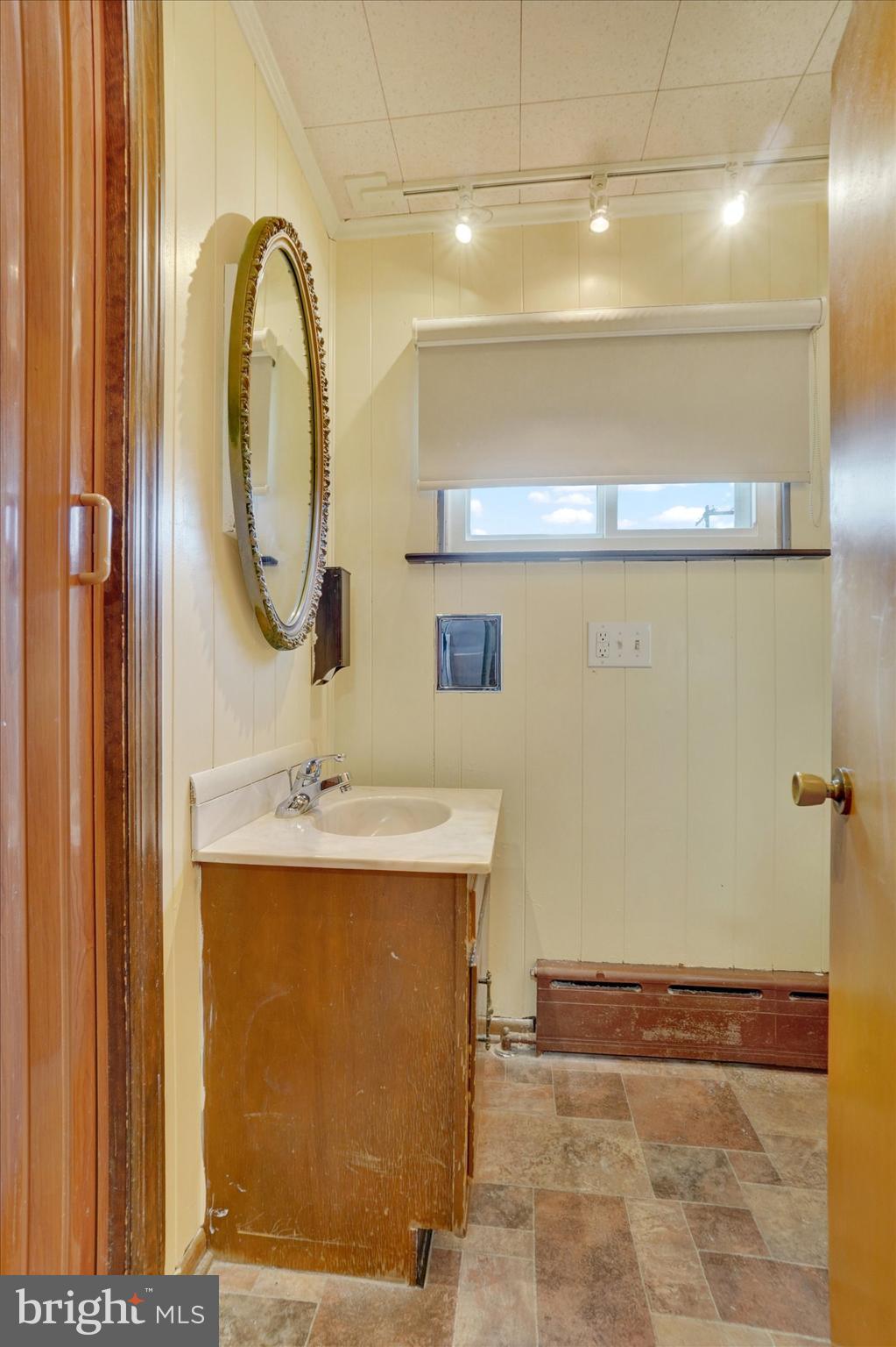 58 East Railroad Street Spring Grove, PA 17362 - Photo 11 of 24 a bathroom with a sink and a mirror