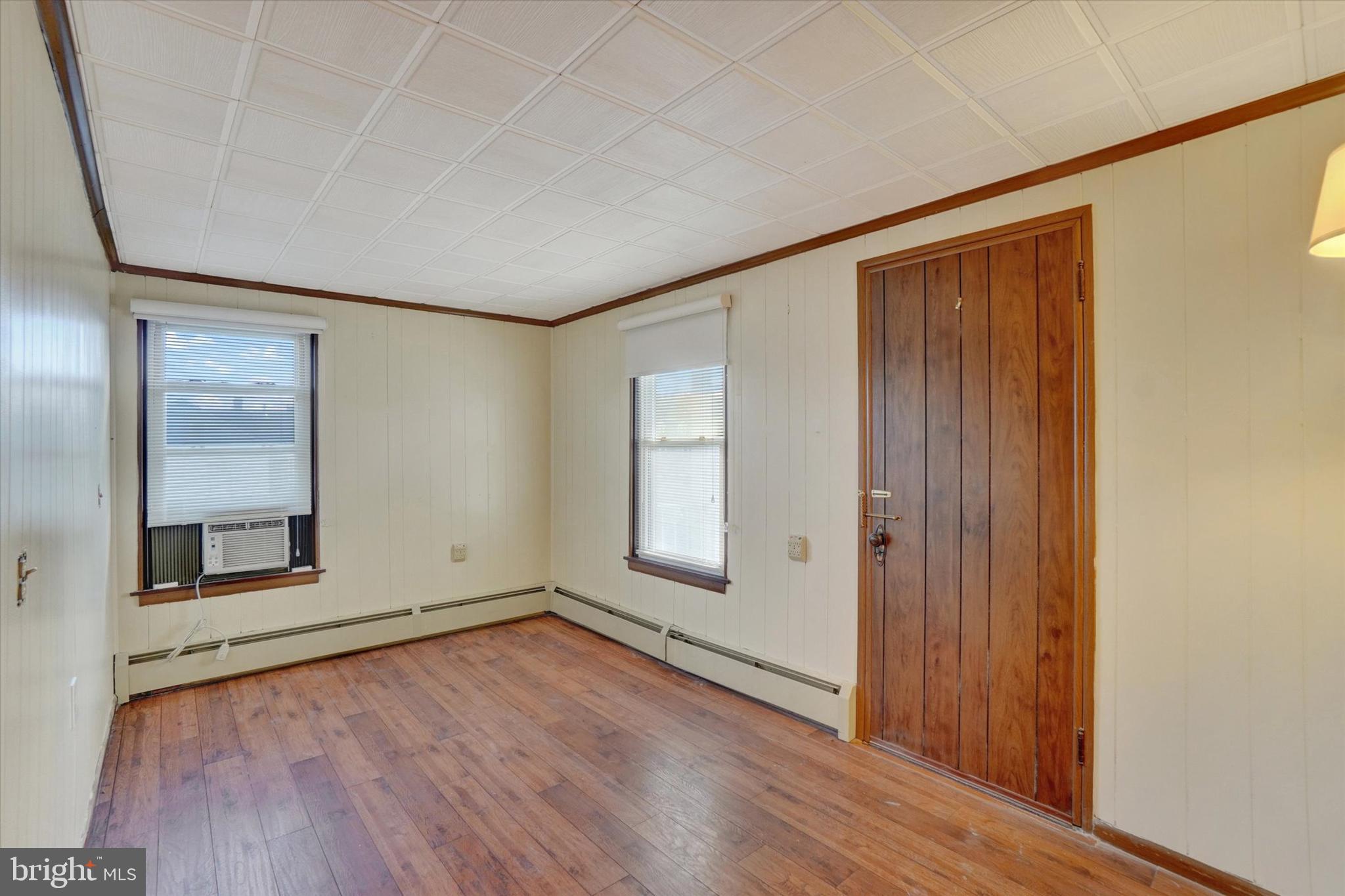 58 East Railroad Street Spring Grove, PA 17362 - Photo 13 of 24 an empty room with wooden floor and windows