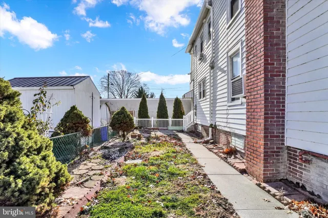 a view of a backyard with potted plants