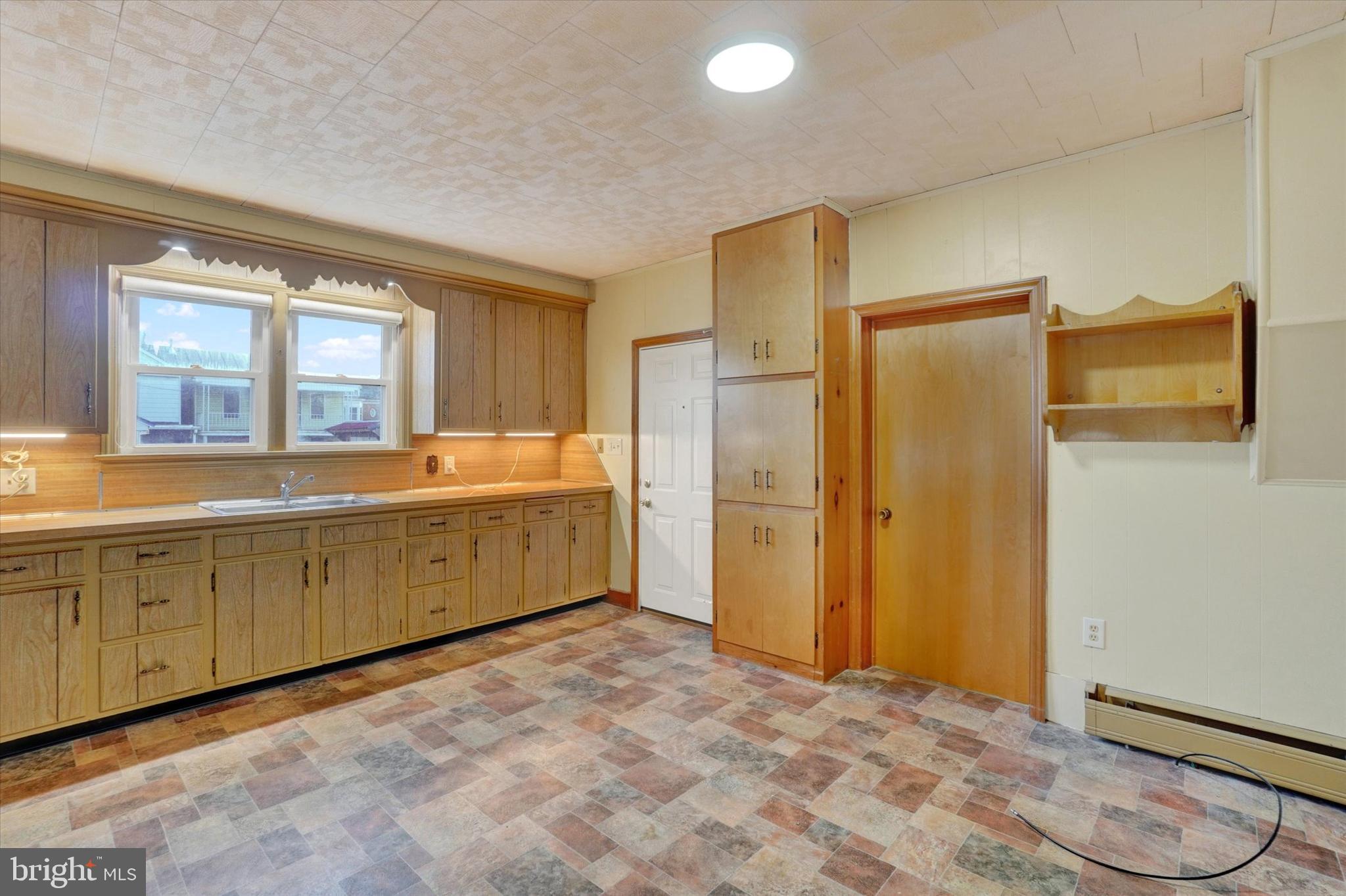 58 East Railroad Street Spring Grove, PA 17362 - Photo 9 of 24 a spacious bathroom with a double vanity sink and a mirror
