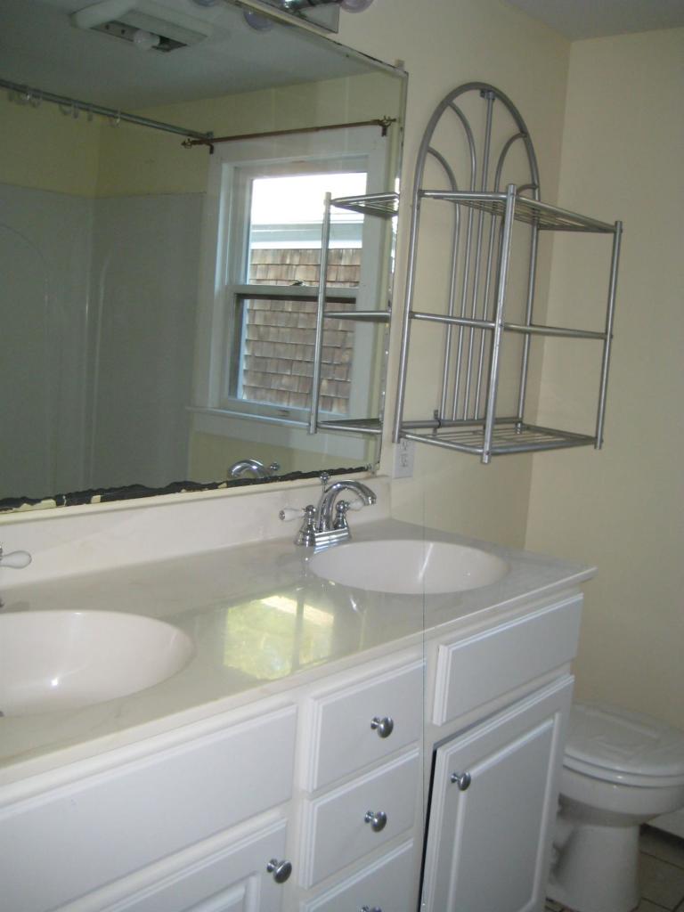 30 Fisher Road Hyannis, MA 02601 - Photo 3 of 8 a bathroom with a sink and a toilet