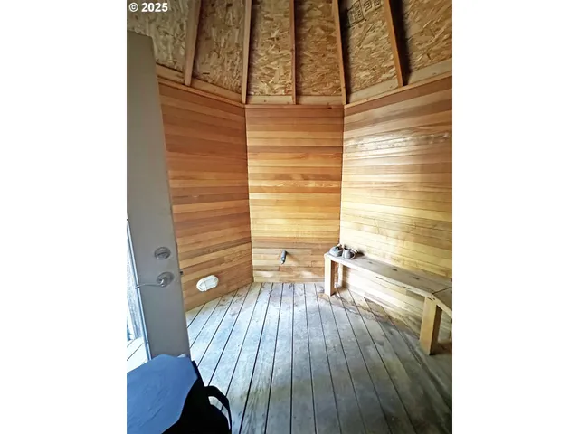 a view of a hallway with chairs