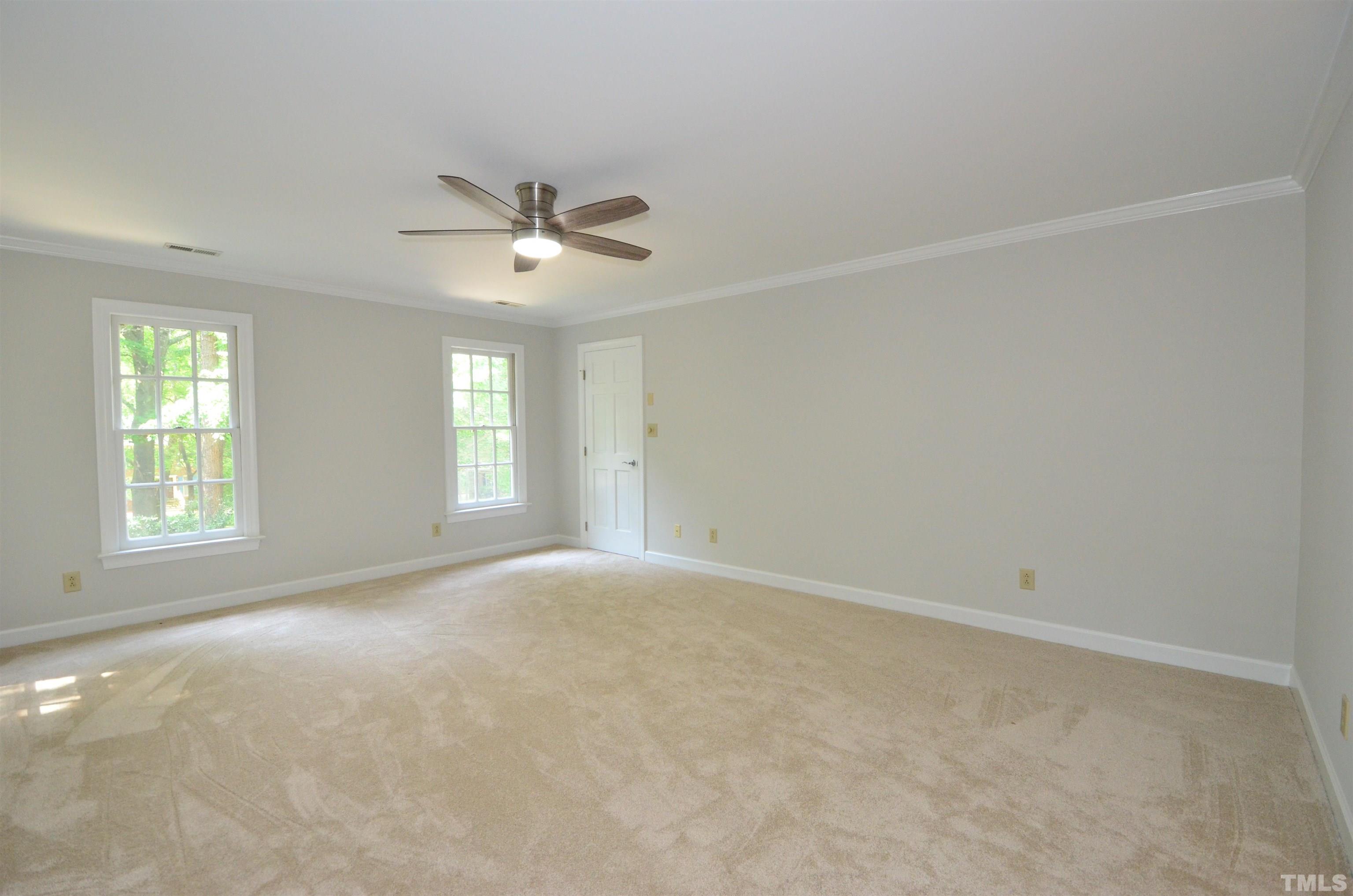 224 Jansmith Lane Raleigh, NC 27615 - Photo 17 of 27 an empty room with windows and ceiling fan
