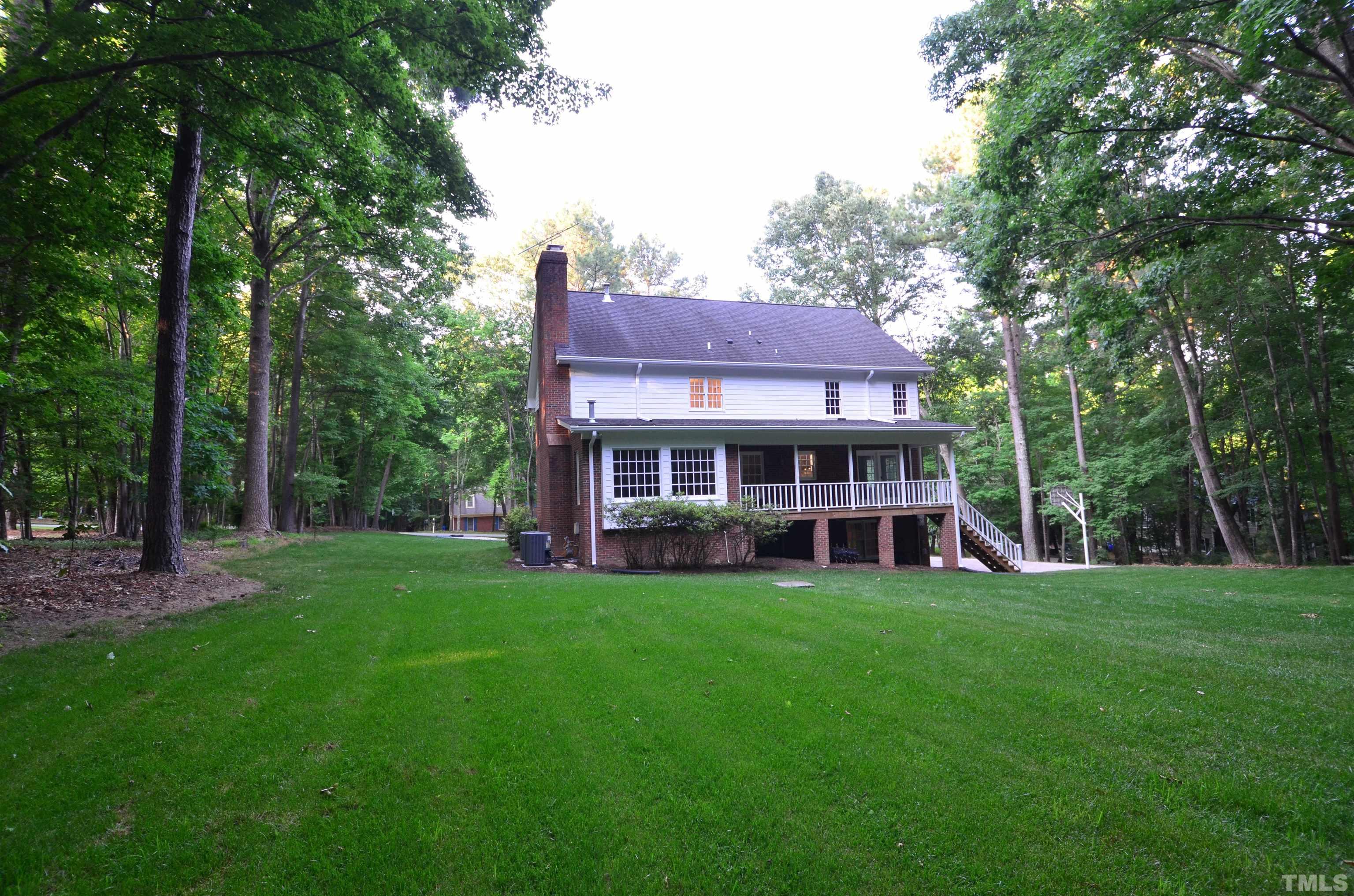 224 Jansmith Lane Raleigh, NC 27615 - Photo 3 of 27 a view of a house with a big yard and large trees