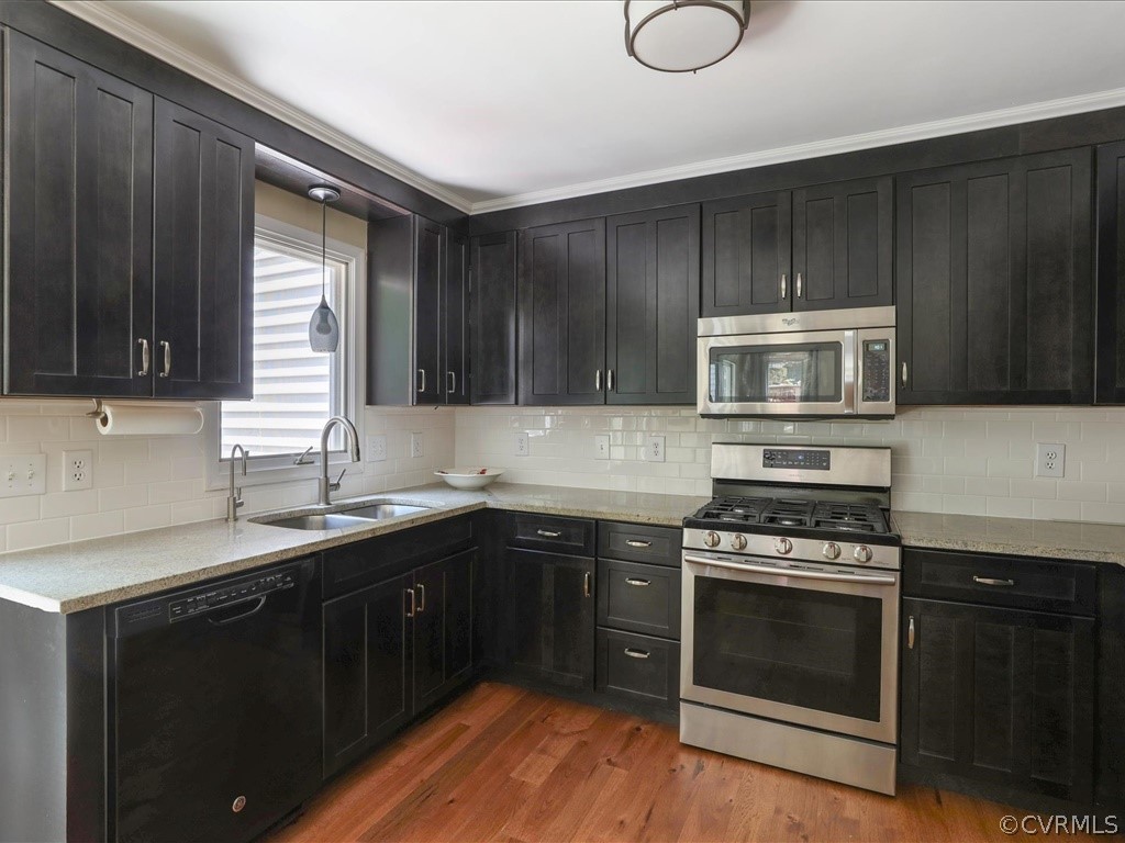 13804 Sandy Oak Road Chester, VA 23831 - Photo 12 of 31 a kitchen with a sink stove and microwave