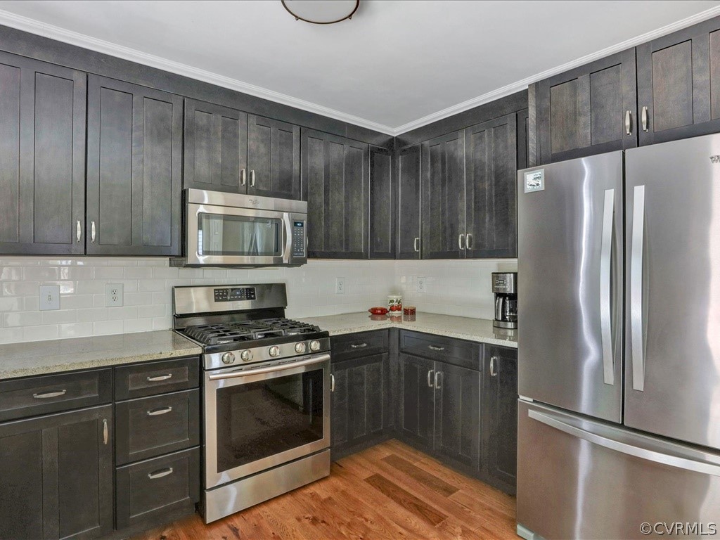 13804 Sandy Oak Road Chester, VA 23831 - Photo 13 of 31 a kitchen with a sink stove and refrigerator