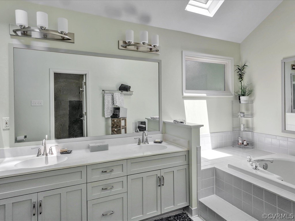 13804 Sandy Oak Road Chester, VA 23831 - Photo 18 of 31 a bathroom with a granite countertop sink double vanity and a mirror