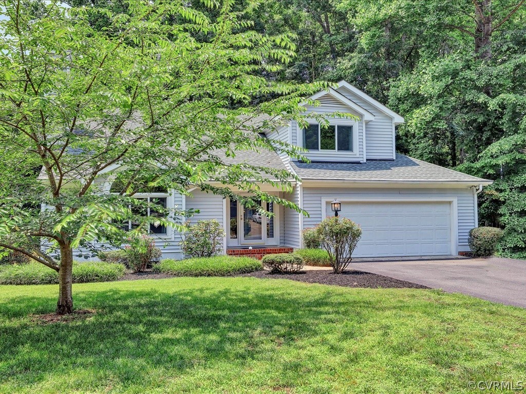 13804 Sandy Oak Road Chester, VA 23831 - Photo 2 of 31 a front view of house with yard and green space