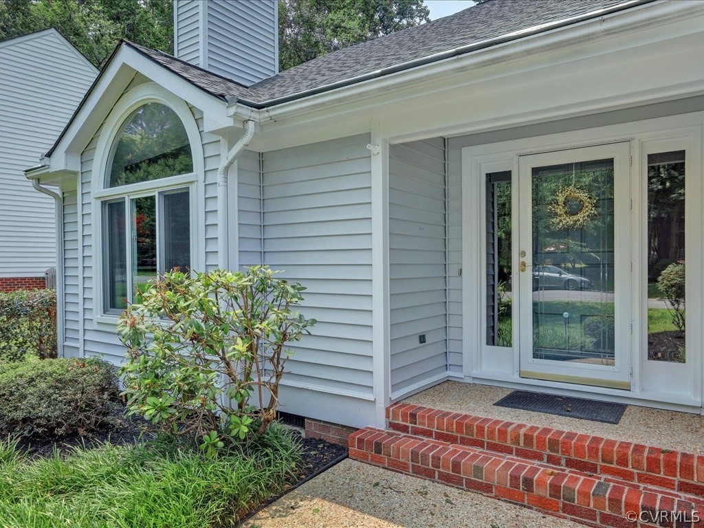13804 Sandy Oak Road Chester, VA 23831 - Photo 3 of 31 a front view of a house with garden