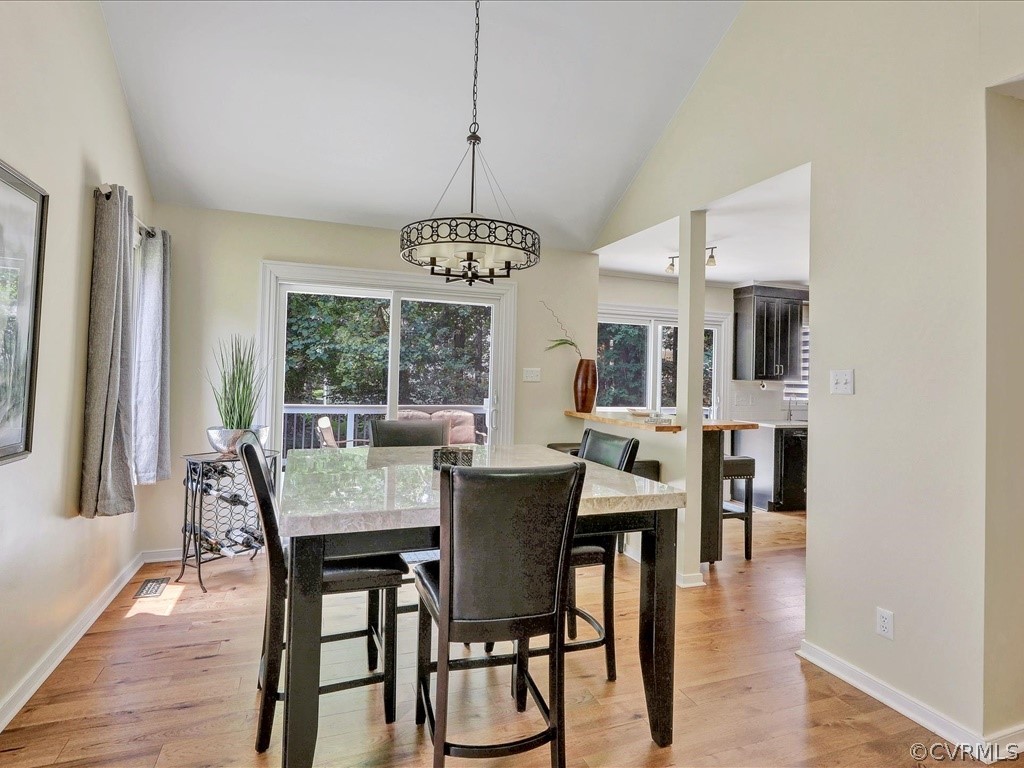 13804 Sandy Oak Road Chester, VA 23831 - Photo 9 of 31 a view of a dining room with furniture window and outside view