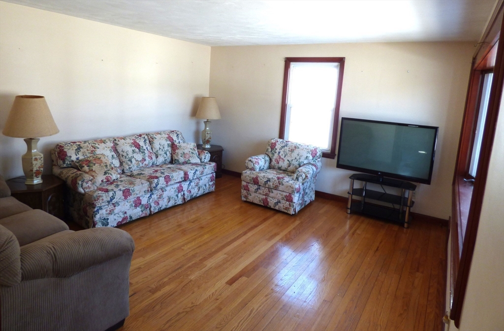 259 Prospect Street Ludlow, MA 01056 - Photo 18 of 30 a living room with furniture and a flat screen tv