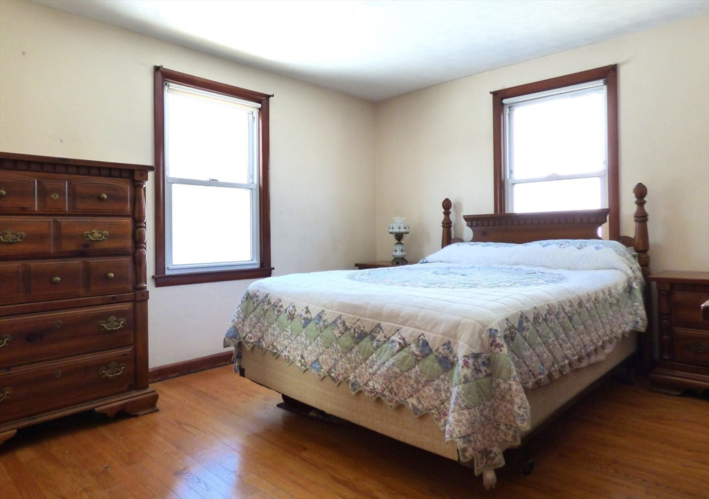 259 Prospect Street Ludlow, MA 01056 - Photo 20 of 30 a bedroom with a bed and a window