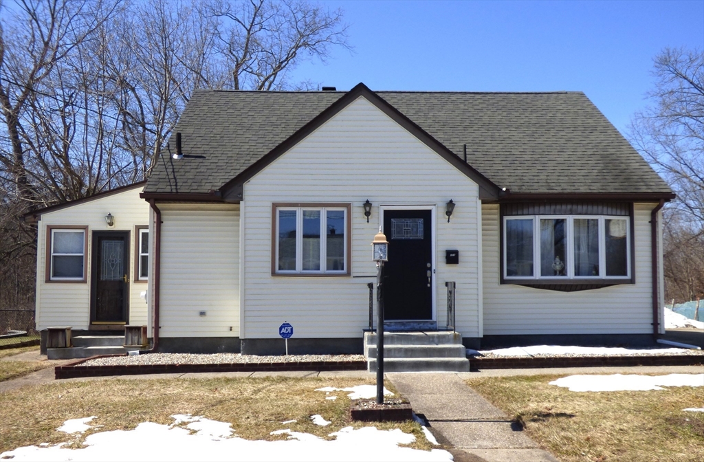 259 Prospect Street Ludlow, MA 01056 - Photo 2 of 30 a front view of a house with a yard
