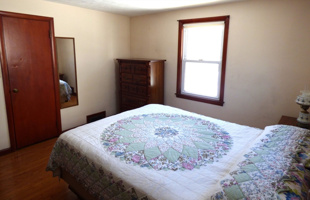 259 Prospect Street Ludlow, MA 01056 - Photo 21 of 30 a bedroom with a bed and a window