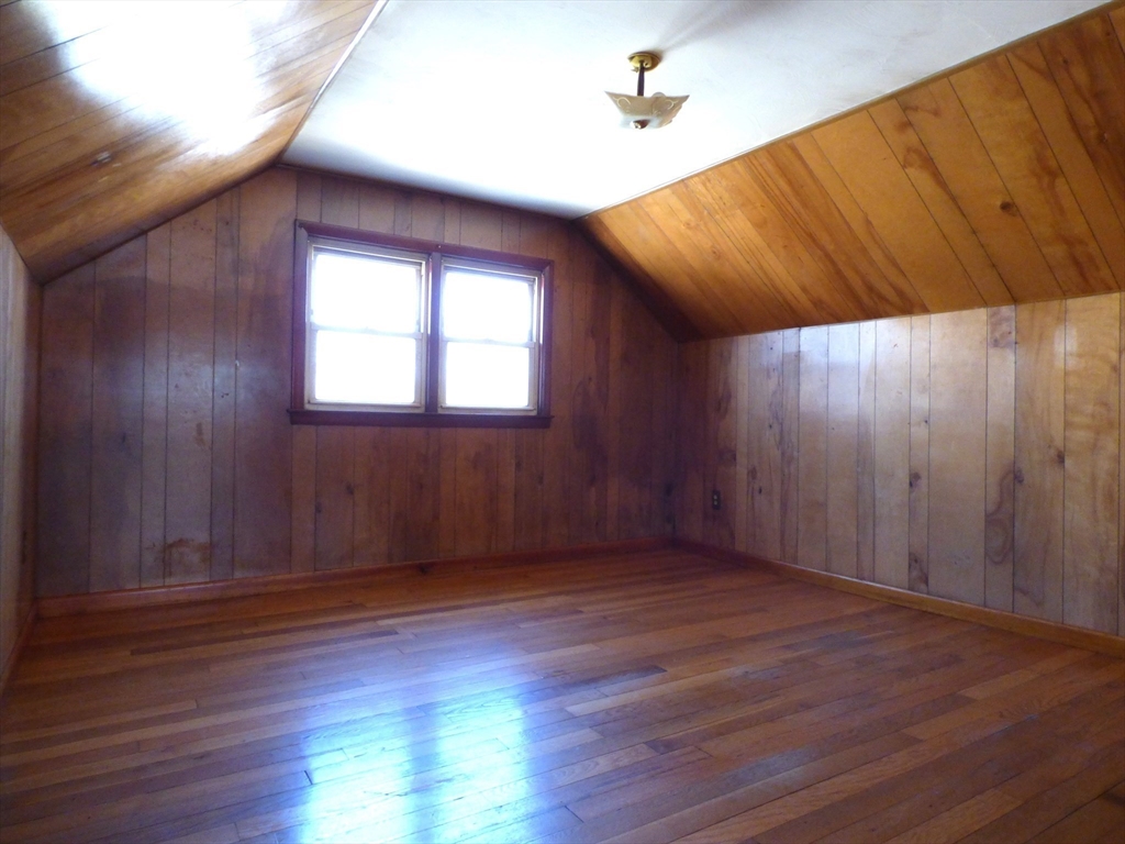 259 Prospect Street Ludlow, MA 01056 - Photo 22 of 30 an empty room with wooden floor and windows