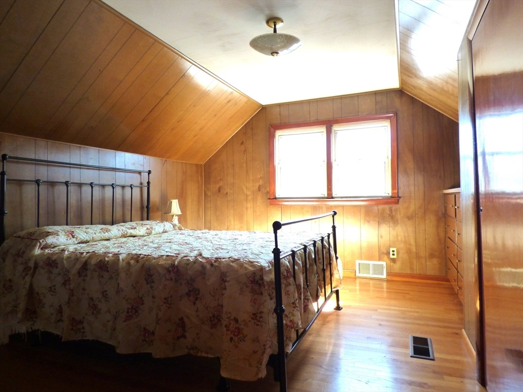 259 Prospect Street Ludlow, MA 01056 - Photo 24 of 30 a bed sitting in a spacious bedroom next to a window