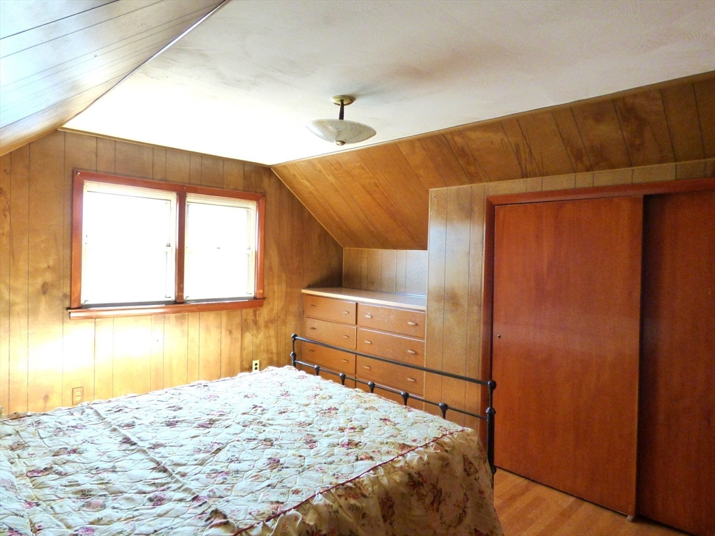 259 Prospect Street Ludlow, MA 01056 - Photo 25 of 30 a bedroom with a bed and a window