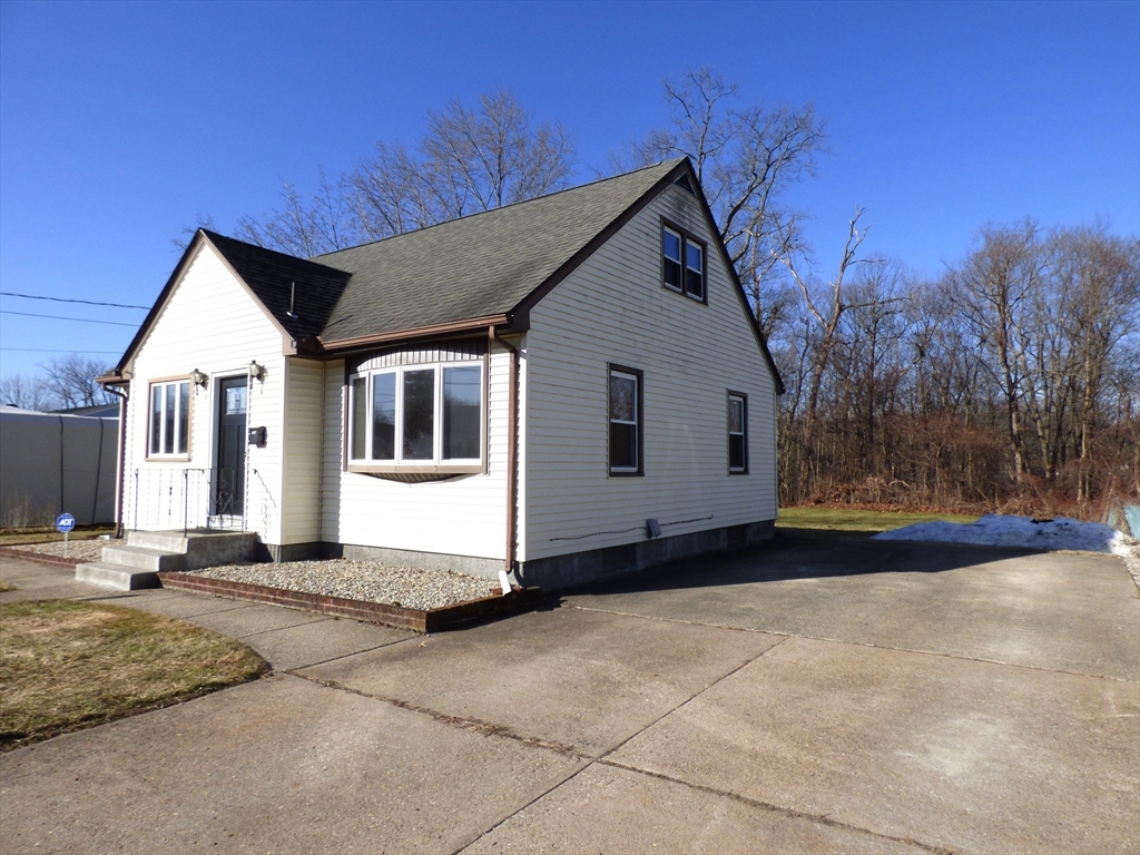 259 Prospect Street Ludlow, MA 01056 - Photo 3 of 30 a front view of a house with a yard