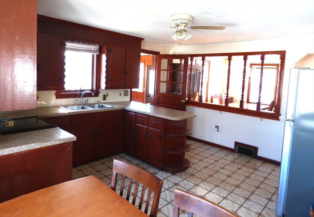 259 Prospect Street Ludlow, MA 01056 - Photo 8 of 30 a kitchen with a sink and large windows