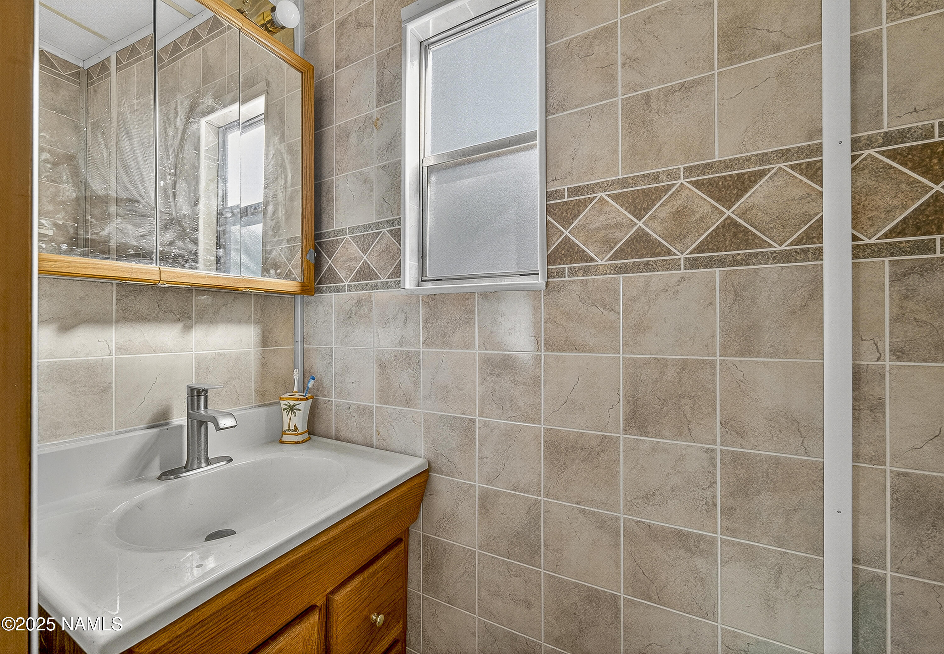 2500 West Rte 66, Unit 83 Flagstaff, AZ 86001 - Photo 16 of 24 a bathroom with a sink and a shower
