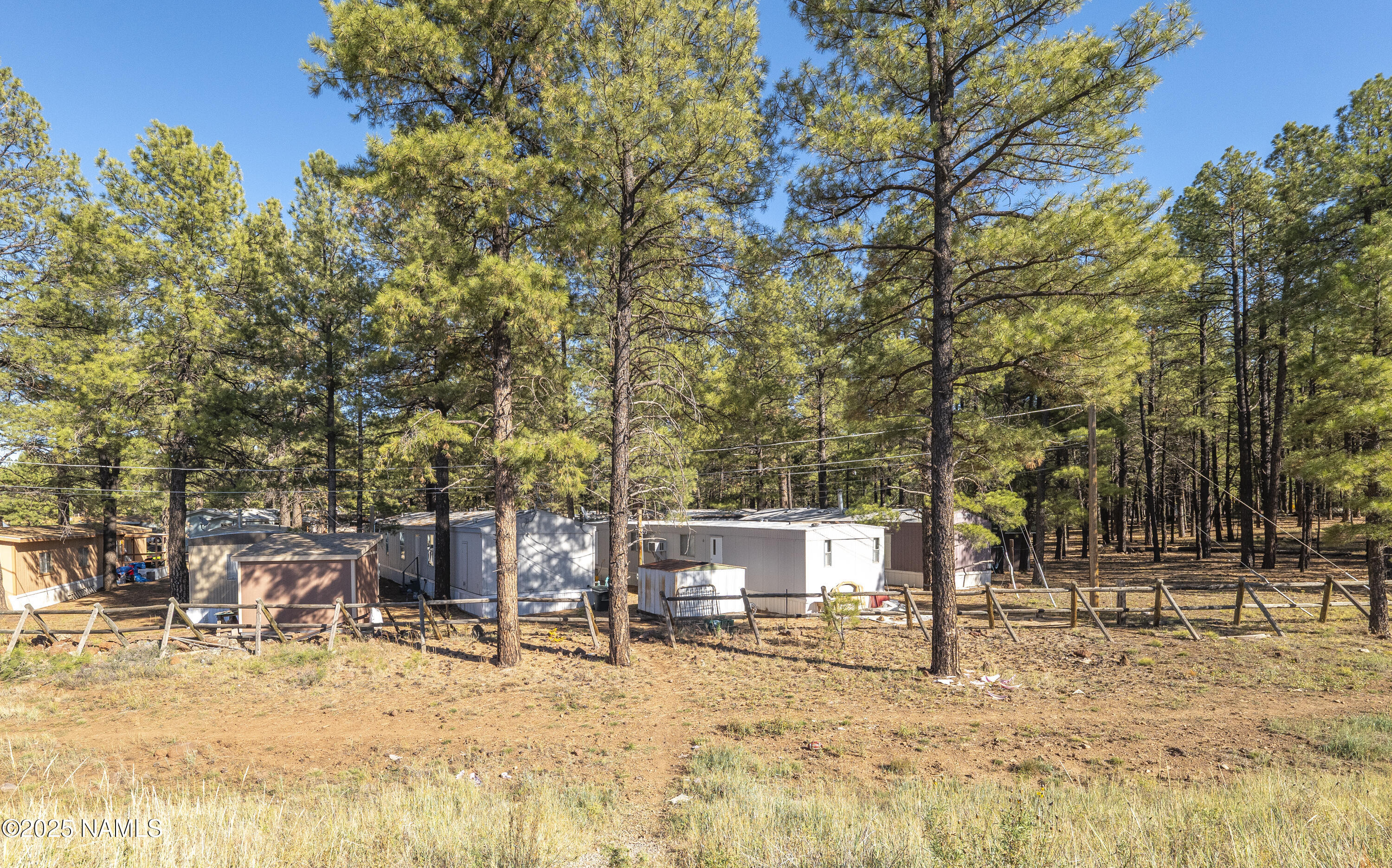 2500 West Rte 66, Unit 83 Flagstaff, AZ 86001 - Photo 21 of 24 a view of a yard with a tree
