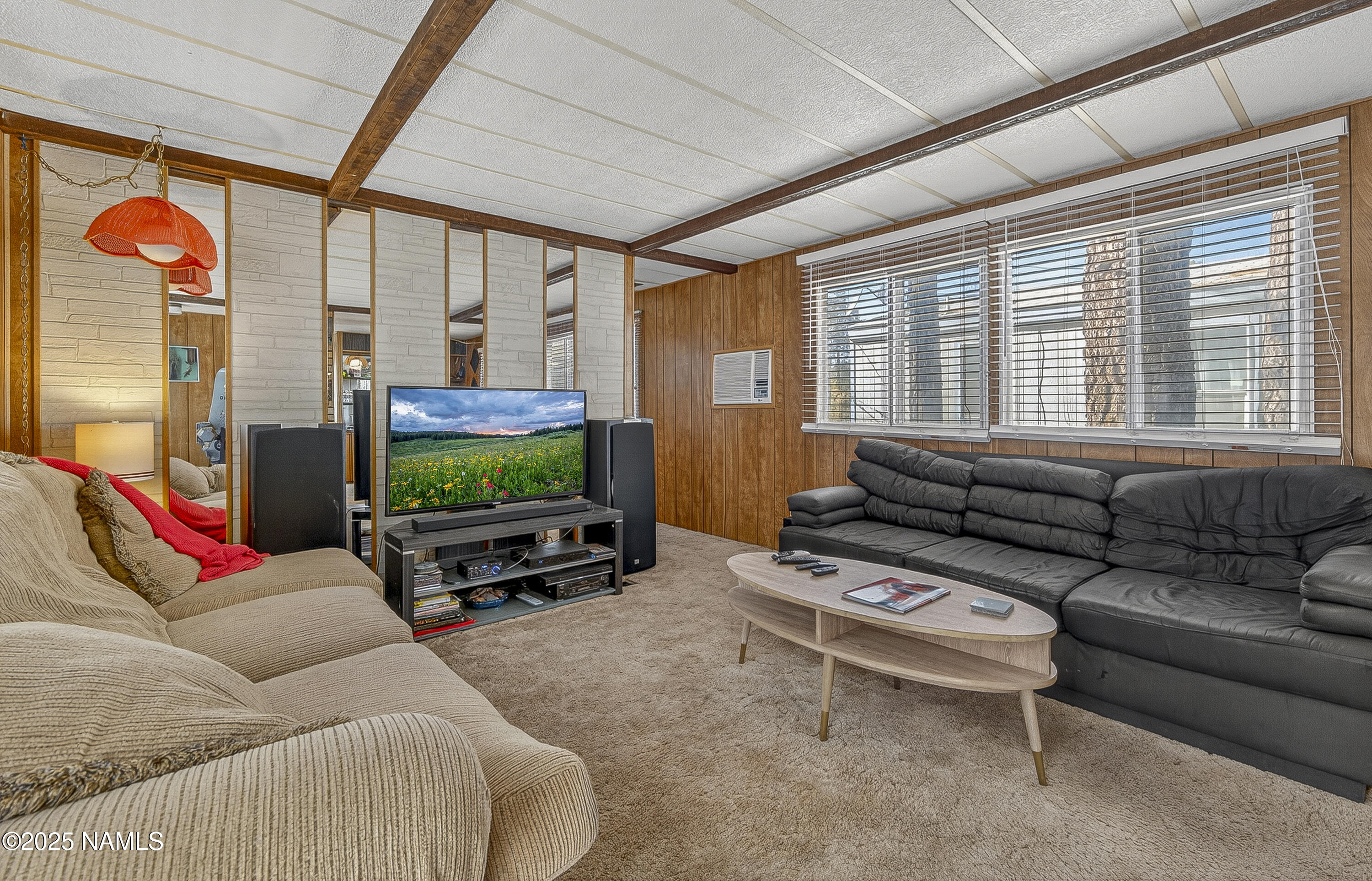 2500 West Rte 66, Unit 83 Flagstaff, AZ 86001 - Photo 4 of 24 a living room with furniture and a flat screen tv