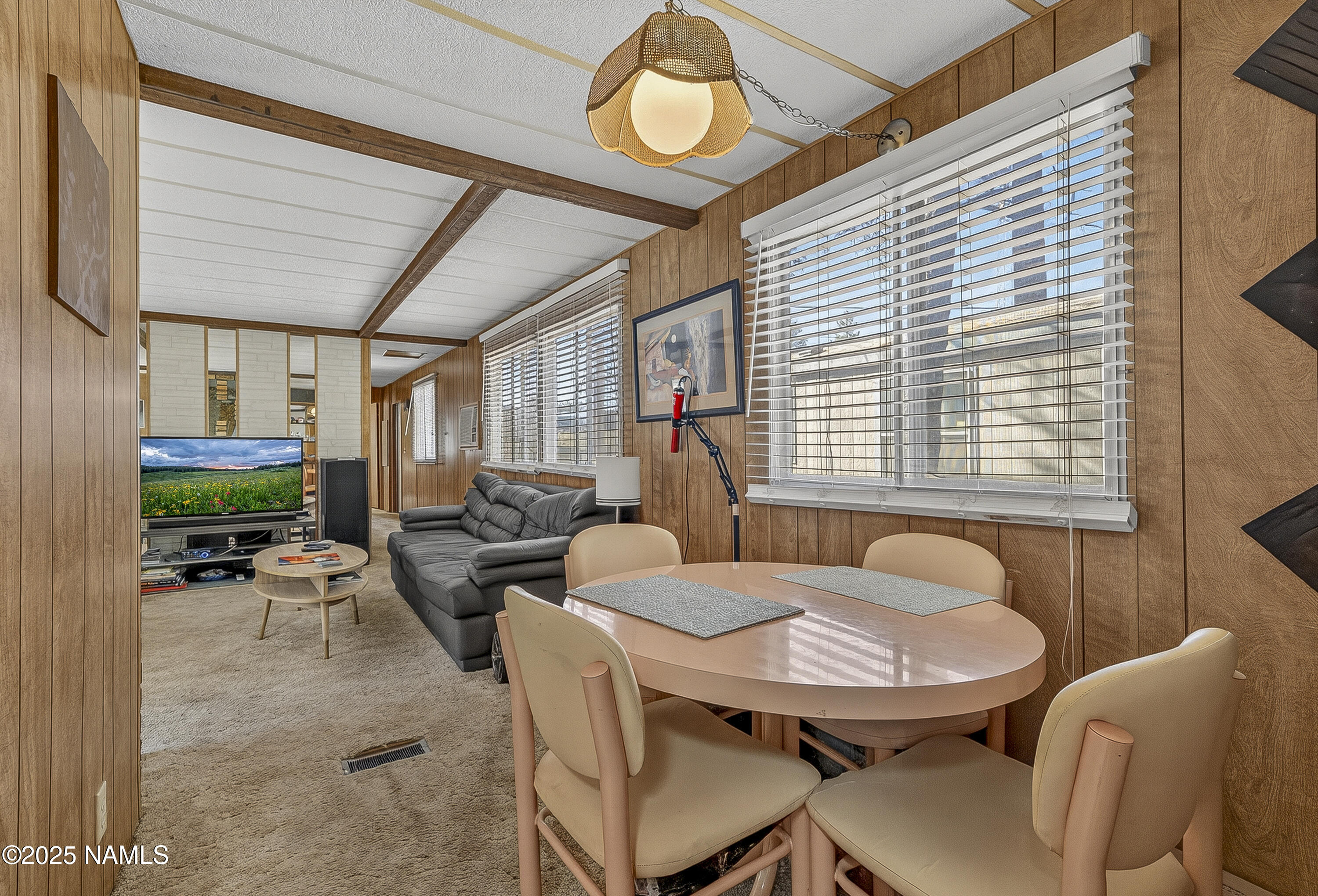 2500 West Rte 66, Unit 83 Flagstaff, AZ 86001 - Photo 9 of 24 a dining room with furniture and a large window