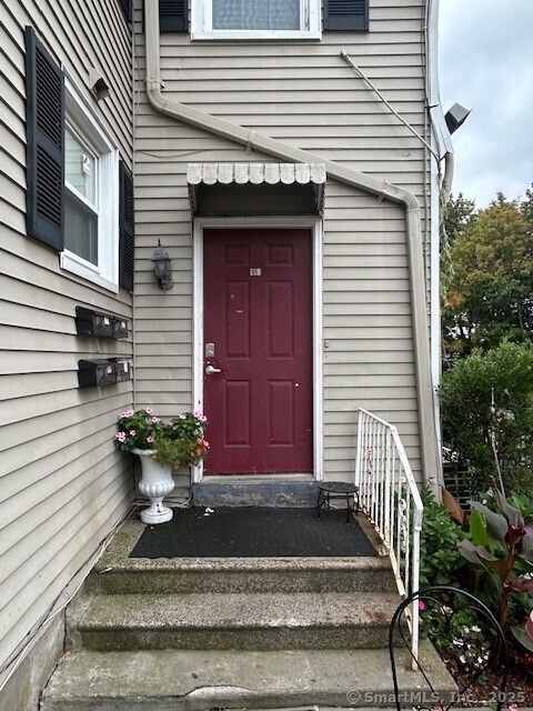 110 East Avenue, Unit 1 Norwalk, CT 06851 - Photo 2 of 11 a front view of a house with potted plants