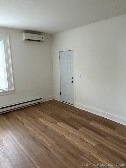 110 East Avenue, Unit 1 Norwalk, CT 06851 - Photo 3 of 11 a view of a room with wooden floor and window