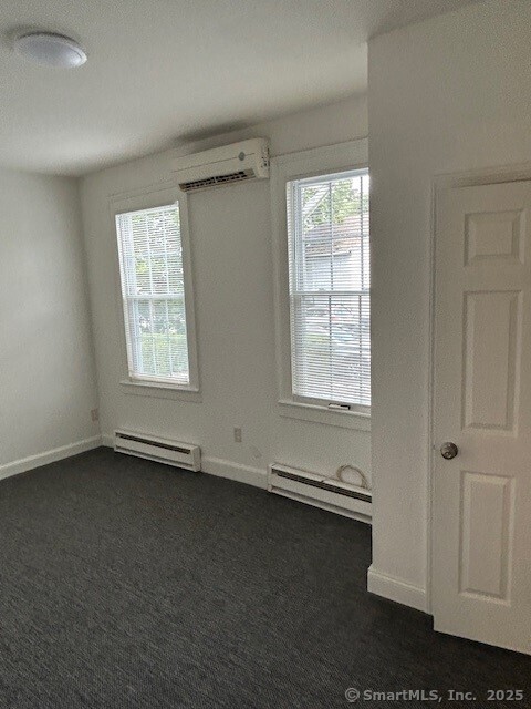 110 East Avenue, Unit 1 Norwalk, CT 06851 - Photo 5 of 11 an empty room with windows