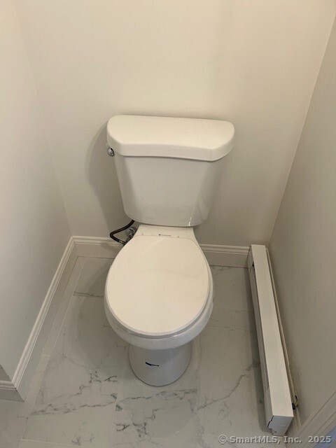 110 East Avenue, Unit 1 Norwalk, CT 06851 - Photo 10 of 11 a white toilet sitting next to a white sink