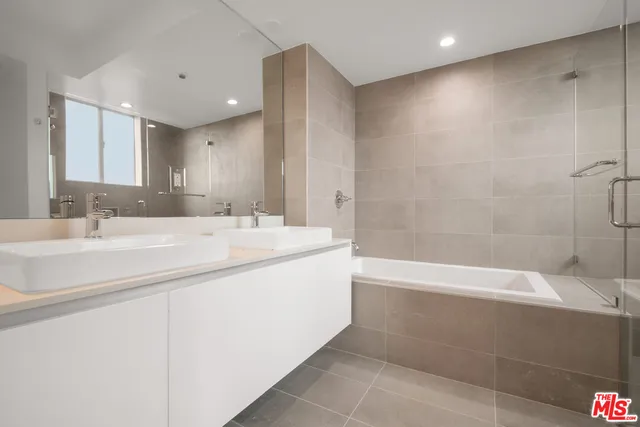 a bathroom with a bathtub and a sink