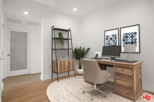 a workspace with furniture and wooden floor