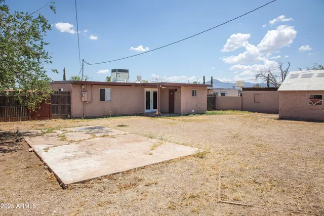 a view of a kitchen with a sink and cabinets