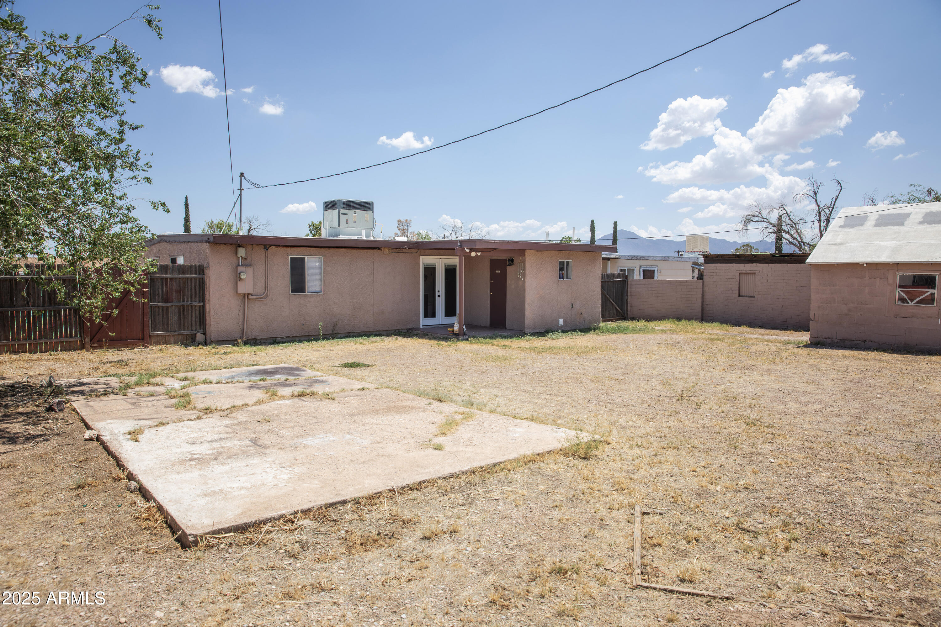 108 Graham Drive Bisbee, AZ 85603 - Photo 14 of 52 a view of a kitchen with a sink and cabinets