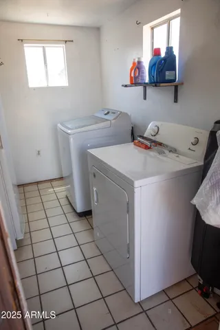 a utility room with a washing machine