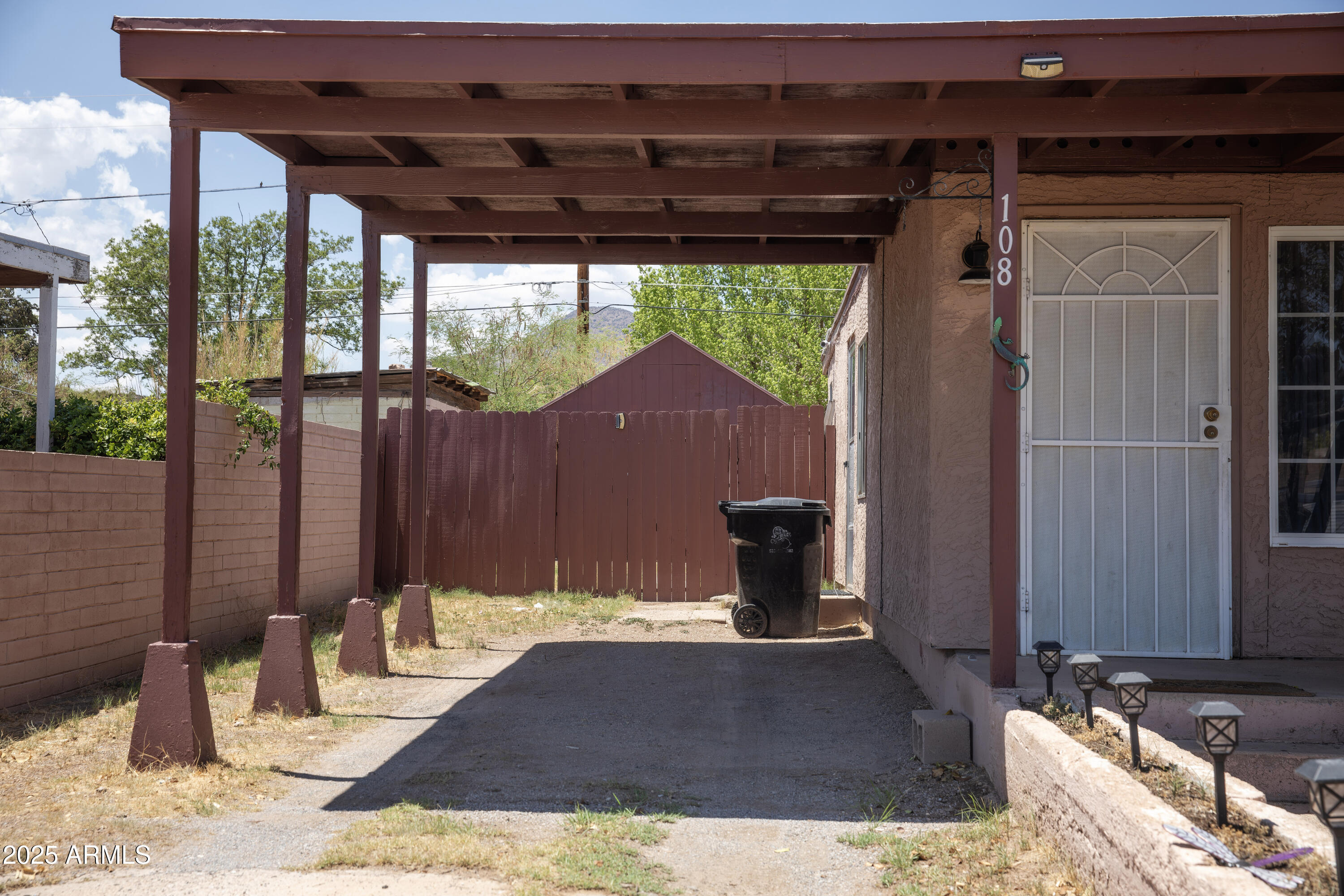 108 Graham Drive Bisbee, AZ 85603 - Photo 2 of 52 a view of a backyard with table and chairs