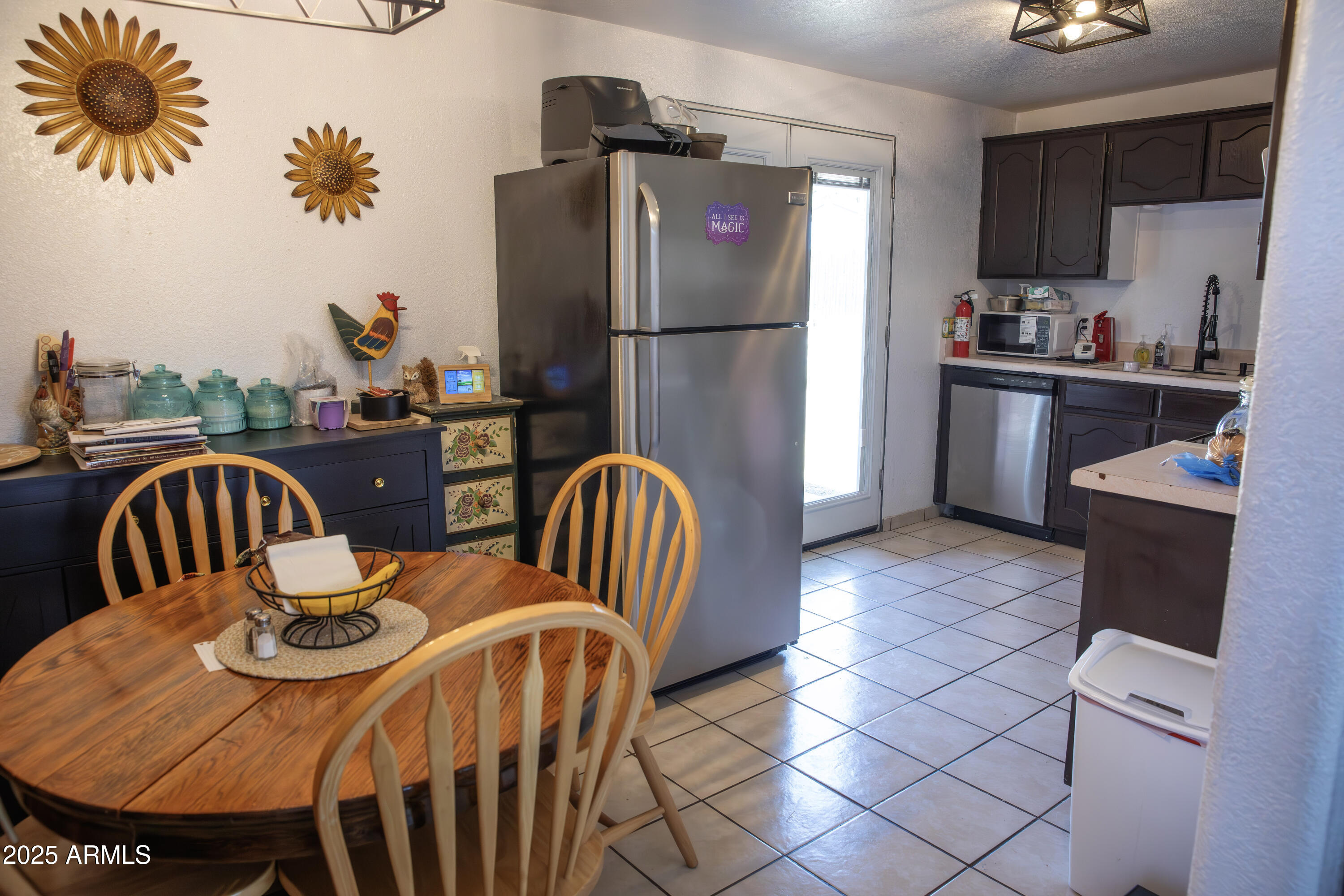 108 Graham Drive Bisbee, AZ 85603 - Photo 23 of 52 a view of a dining room with furniture a chandelier and wooden floor