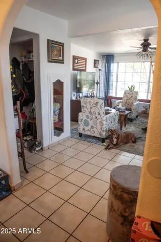 a kitchen with stainless steel appliances kitchen island granite countertop a dining table and chairs