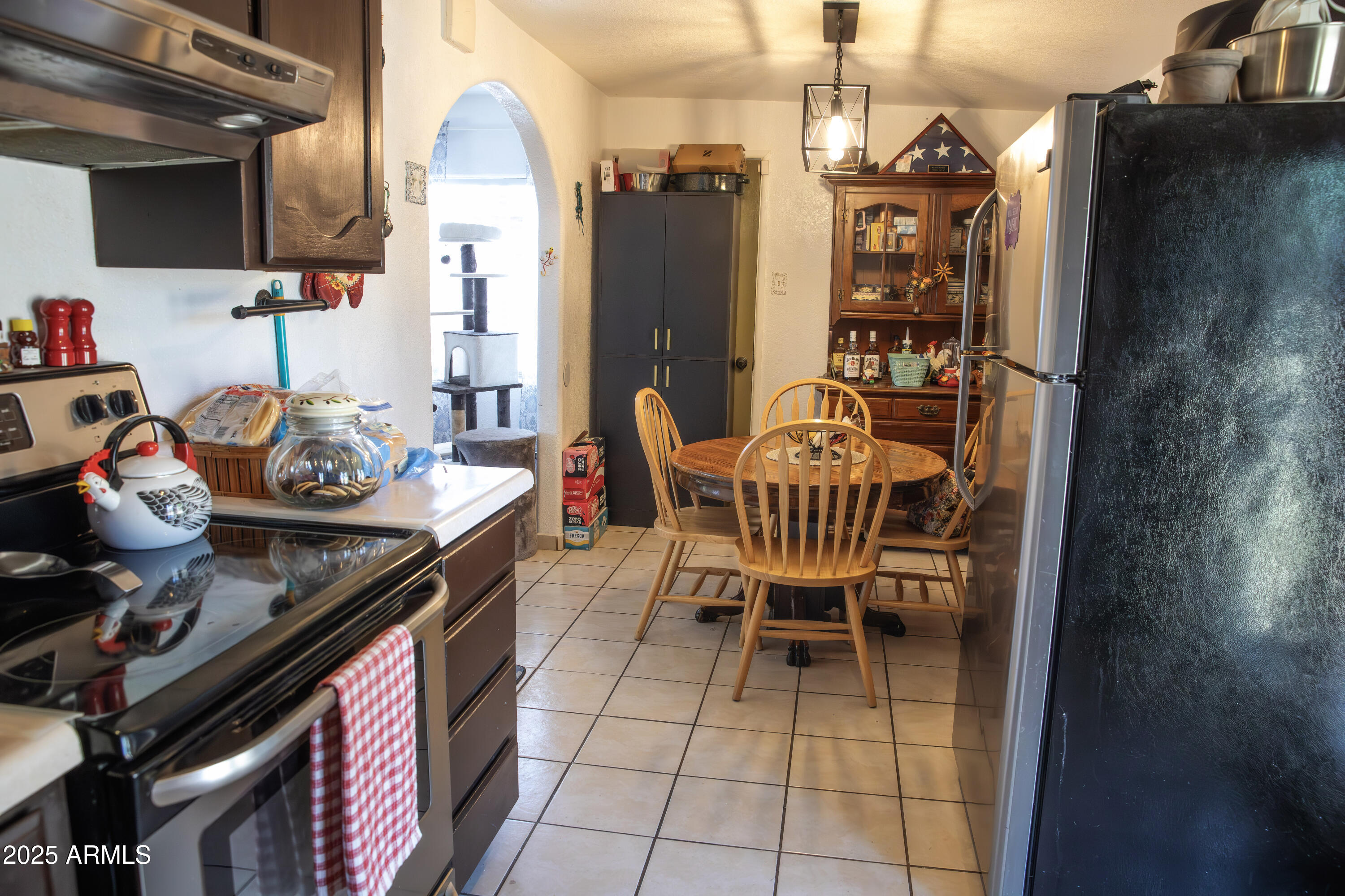 108 Graham Drive Bisbee, AZ 85603 - Photo 27 of 52 a dining room with furniture and wooden floor