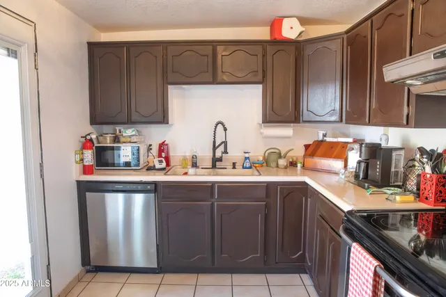 a dining room with furniture a livingroom and chandelier