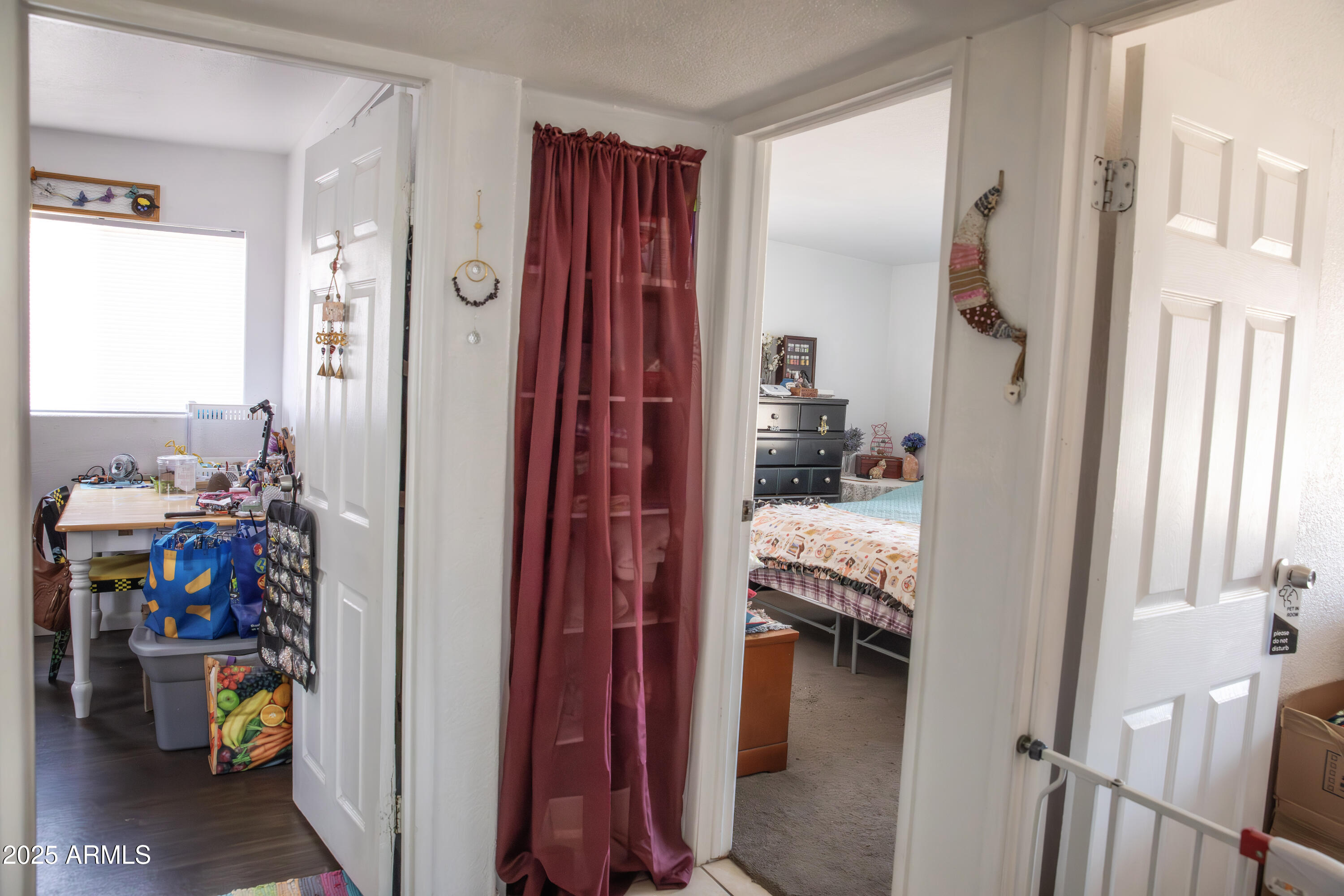 108 Graham Drive Bisbee, AZ 85603 - Photo 36 of 52 a bedroom with a bed and a view of bathroom