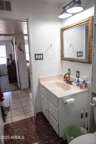 a bedroom with a bed and a dresser in it