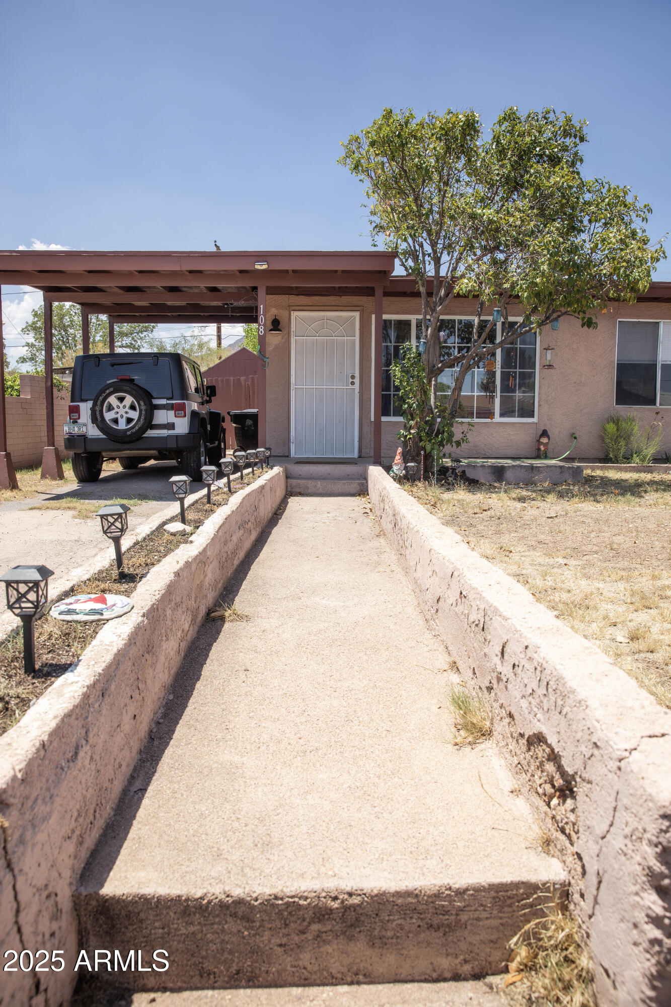 108 Graham Drive Bisbee, AZ 85603 - Photo 4 of 52 a view of a car park in front of a building